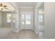 Bright foyer with wood-look floors and glass panel door leading to outside at 112 Infinity Ln., Loris, SC 29569