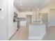 Bright kitchen featuring white cabinets, stainless steel appliances, and granite countertops at 112 Infinity Ln., Loris, SC 29569