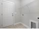 Functional laundry room with shelving, utility sink, and connections for a washer and dryer at 112 Infinity Ln., Loris, SC 29569