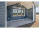 Covered patio with blue siding, ceiling fan, and views of the surrounding landscape at 112 Infinity Ln., Loris, SC 29569