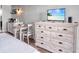 Bedroom featuring a TV and a dresser, with a small dining table and chairs for meals at 1207 S Ocean Blvd. # 20509, Myrtle Beach, SC 29577