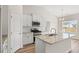 Modern kitchen featuring white cabinets, stainless steel appliances, granite countertops, and a large island at 343 Hayloft Circle, Conway, SC 29526