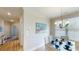 Dining area with light walls and a coastal-themed painting at 35 Delray Dr. # 1-E, Murrells Inlet, SC 29576