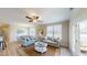 Spacious living room with comfy sofas, a coffee table, and access to a balcony at 35 Delray Dr. # 1-E, Murrells Inlet, SC 29576