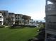 Aerial view of oceanfront property, pool, and lush landscaping at 5601 Ocean Blvd. N # 202 A, Myrtle Beach, SC 29577