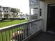 Balcony view of oceanfront community, pool, and lawn area at 5601 Ocean Blvd. N # 202 A, Myrtle Beach, SC 29577