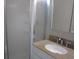 Bathroom with granite countertop, sink, and shower at 5601 Ocean Blvd. N # 202 A, Myrtle Beach, SC 29577