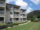 Attractive building exterior with balconies and landscaping at 5601 Ocean Blvd. N # 202 A, Myrtle Beach, SC 29577