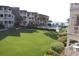 Well-maintained lawn, pool, and oceanfront building view at 5601 Ocean Blvd. N # 202 A, Myrtle Beach, SC 29577