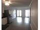 Spacious living room with wood-look flooring and sliding glass doors at 5601 Ocean Blvd. N # 202 A, Myrtle Beach, SC 29577