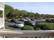 View of the parking lot with landscaping and building at 5601 Ocean Blvd. N # 202 A, Myrtle Beach, SC 29577