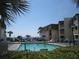 Community pool with ample deck space and ocean views at 5601 Ocean Blvd. N # 202 A, Myrtle Beach, SC 29577