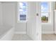 Light filled bathroom featuring a tub and bright window at Lot 40 Lineback Pl. # 40, Longs, SC 29568