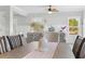 Dining area with a wooden table, stylish chairs, and flowers in a bright open space at Lot 40 Lineback Pl. # 40, Longs, SC 29568