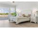 Bright main bedroom with a sliding glass door, wood floors, and coastal decor at Lot 40 Lineback Pl. # 40, Longs, SC 29568