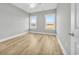 Bedroom featuring a ceiling fan, neutral walls, and windows with wooded views at Lot 41 Lineback Pl. # 41, Longs, SC 29568