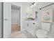 Stylish bathroom featuring granite countertop, neutral colors and a view out the open door at Lot 42 Lineback Pl. # 42, Longs, SC 29568