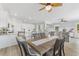 Inviting dining area featuring stylish chairs, a wooden table, and an open layout to the kitchen and living room at Lot 42 Lineback Pl. # 42, Longs, SC 29568