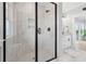 Luxurious bathroom shower with marble tiles, built-in bench, and sleek glass enclosure at Lot 42 Lineback Pl. # 42, Longs, SC 29568