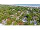 Aerial view of homes near the ocean showcasing lush trees and coastal charm at 405 N Highland Way, Myrtle Beach, SC 29572