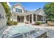 Relax in this backyard with a jacuzzi, outdoor seating, and sliding glass door access to the interior at 405 N Highland Way, Myrtle Beach, SC 29572