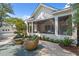 Inviting backyard with screened porch, hot tub, and comfortable seating area, perfect for relaxing and entertaining at 405 N Highland Way, Myrtle Beach, SC 29572