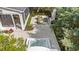 Overhead shot displaying a serene backyard oasis with a hot tub, fireplace, screened porch, and cozy seating area at 405 N Highland Way, Myrtle Beach, SC 29572