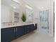 Elegant bathroom with double vanity, modern fixtures, and a glass-enclosed shower, with tile from floor to ceiling at 405 N Highland Way, Myrtle Beach, SC 29572