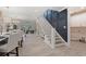 Open-concept interior with hardwood floors, a staircase, and views of the living area at 405 N Highland Way, Myrtle Beach, SC 29572