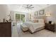 Bright main bedroom boasts a trey ceiling, access to the hot tub, and decorative touches at 405 N Highland Way, Myrtle Beach, SC 29572