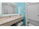 Bathroom featuring a granite vanity, decorative mirror and shower with tub at 7200 Ocean Blvd. N # 254, Myrtle Beach, SC 29572