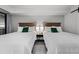 Inviting bedroom featuring two queen beds with white linens and wood headboards at 7200 Ocean Blvd. N # 254, Myrtle Beach, SC 29572