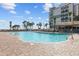 Resort pool with palm trees and a tiki bar offering a relaxing vacation atmosphere at 7200 Ocean Blvd. N # 254, Myrtle Beach, SC 29572