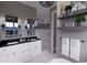 Modern bathroom featuring double sinks, a glass-enclosed shower, and elegant fixtures at 409 N Highland Way, Myrtle Beach, SC 29572