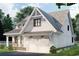 Charming craftsman-style home featuring a two-car garage, inviting front porch and beautiful architectural details at 409 N Highland Way, Myrtle Beach, SC 29572