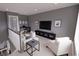 Upstairs living area with comfortable seating, TV, and a view of the staircase at 409 N Highland Way, Myrtle Beach, SC 29572