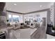 Open-concept living area with a fireplace, comfortable seating, and an adjacent kitchen at 409 N Highland Way, Myrtle Beach, SC 29572