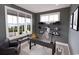 Cozy home office with ample natural light, built-in shelving, and a comfortable workspace at 409 N Highland Way, Myrtle Beach, SC 29572