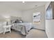Bright bedroom with neutral carpet, a full-sized bed and a view from the window at 4723 Huckleberry Ln., Conway, SC 29526