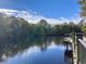 Beautiful water view along the calm water, with trees and branches on the waterfront at 4723 Huckleberry Ln., Conway, SC 29526