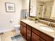 Bathroom featuring a double sink vanity with granite countertops, a large mirror, and tiled floors at 516 Papyrus Circle # 516, Little River, SC 29566