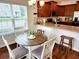 Eat-in kitchen with granite countertops, stainless appliances, wood cabinets, and a breakfast table at 516 Papyrus Circle # 516, Little River, SC 29566