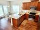 Kitchen and breakfast nook area with stainless steel appliances, wood cabinets, and a window at 516 Papyrus Circle # 516, Little River, SC 29566