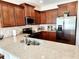 Beautiful kitchen features granite counters, stainless steel appliances and rich wood cabinets at 516 Papyrus Circle # 516, Little River, SC 29566