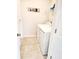 Well-lit laundry room includes a washer, dryer, shelving, and tile flooring at 516 Papyrus Circle # 516, Little River, SC 29566