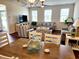 Open-concept living room and dining area with plenty of natural light and stylish furnishings at 516 Papyrus Circle # 516, Little River, SC 29566