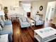 Spacious living room and dining area with hardwood floors, modern decor, and lots of light at 516 Papyrus Circle # 516, Little River, SC 29566