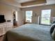 Bright main bedroom featuring large windows, a walk-in closet, and neutral decor at 516 Papyrus Circle # 516, Little River, SC 29566