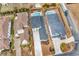 Aerial view of the property showcasing the home, driveway, landscaping, and neighboring houses at 835 Waterton Ave., Myrtle Beach, SC 29579