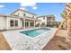 Beautiful backyard featuring a sparkling pool, spa, covered patio, and neatly landscaped surroundings at 835 Waterton Ave., Myrtle Beach, SC 29579